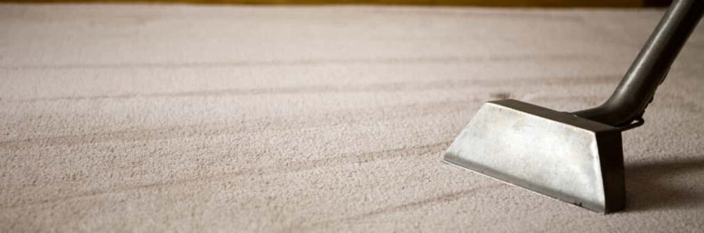 This is a photo of a carpet steam cleaner cleaning a cream carpet works carried out by Purley Carpet Cleaning Solutions.