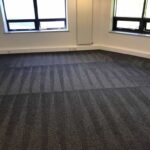 This is a photo of a grey office carpet that has just been professionally steam cleaned works carried out by Purley Carpet Cleaning Solutions.