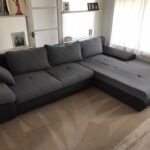 This is a photo of a grey L shape sofa that has been professionally steam cleaned, also the beige carpets have been steam cleaned too works carried out by Purley Carpet Cleaning Solutions.