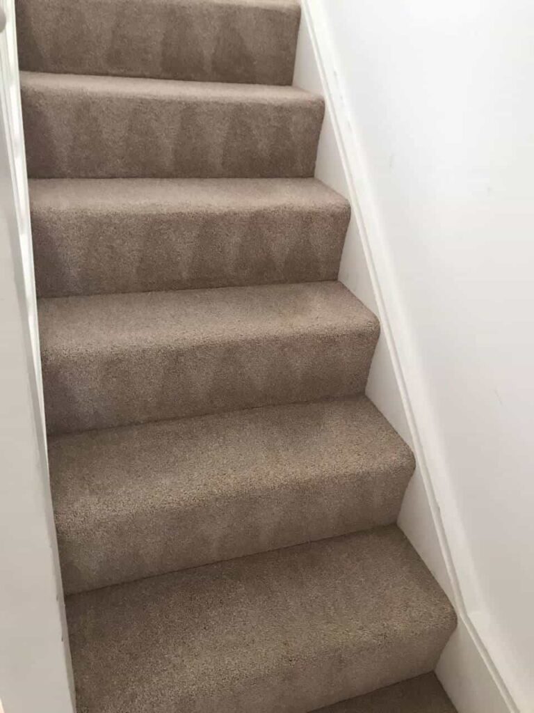 This is an after photo of Purley Carpet Cleaning Solutions staircase with a beige carpet that has been cleaned.